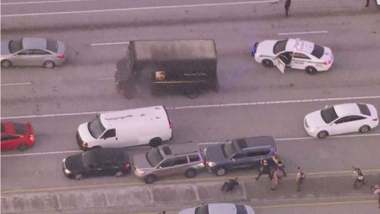 Four people, including a UPS driver, were killed Thursday after robbers stole the driver's truck and led police on a chase that ended in gunfire at a busy Florida intersection. (Courtesy of WSVN)