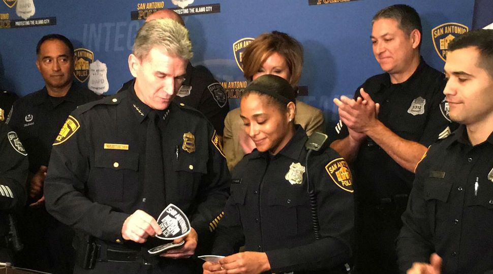 Chief William McManus gives Officer Perla Dominiguez her SAPD SWAT badges (Spectrum News)