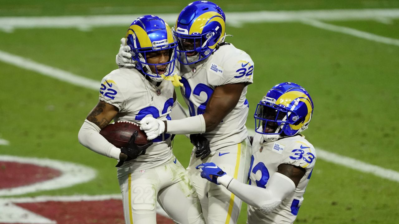 Rams cornerback Troy Hill (22) celebrates his interception for a touchdown with strong safety Jordan Fuller (32) and safety Nick Scott (33) during an NFL game, Sunday, Dec. 6, 2020, in Glendale, Ariz. (AP/Rick Scuteri)