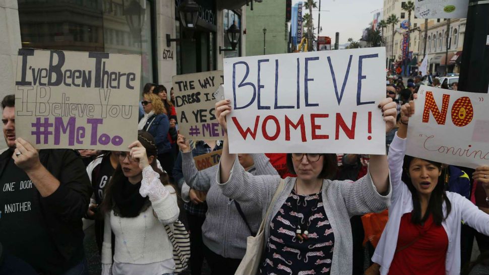 Participants march against sexual assault and harassment at the #MeToo March in the Hollywood section of Los Angeles on Sunday, Nov. 12, 2017. (AP Photo/Damian Dovarganes)