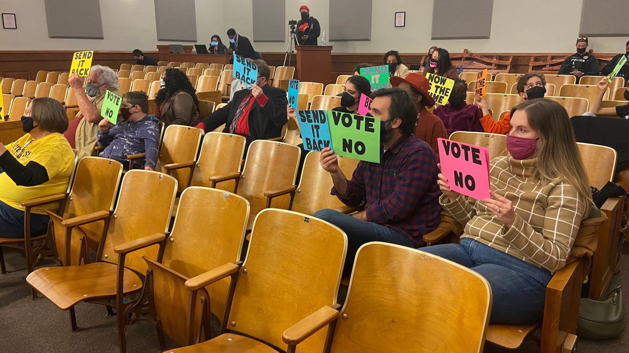 Community members spoke out against a proposed LMPD contract Monday. (Spectrum News KY/Adam K. Raymond)