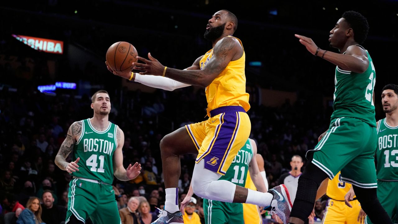 Los Angeles Lakers forward LeBron James drives to the basket against the Boston Celtics during the second half of an NBA basketball game Tuesday, Dec. 7, 2021, in Los Angeles. (AP Photo/Marcio Jose Sanchez)