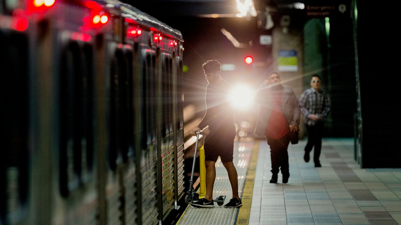 Passengers board a train at Union Station in Los Angeles Wednesday, Jan. 11, 2017. (AP Photo/Damian Dovarganes)