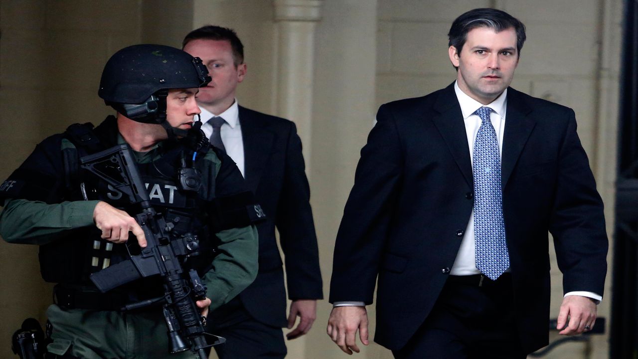 FILE - In this Monday, Dec. 5, 2016, file photo, former South Carolina officer, Michael Slager, right, walks from the Charleston County Courthouse under the protection of the Charleston County Sheriff's Department after a mistrial was declared for his trial in Charleston, S.C. Slager, who fatally shot a black motorist, Walter Scott, in 2015, could learn his fate as soon as his federal sentencing hearing winds down. On Thursday, Dec. 7, 2017, attorneys are expected to call friends and relatives of both men who'll tell the judge how Scott's death and the officer's arrest have impacted their lives. (AP Photo/Mic Smith, File)