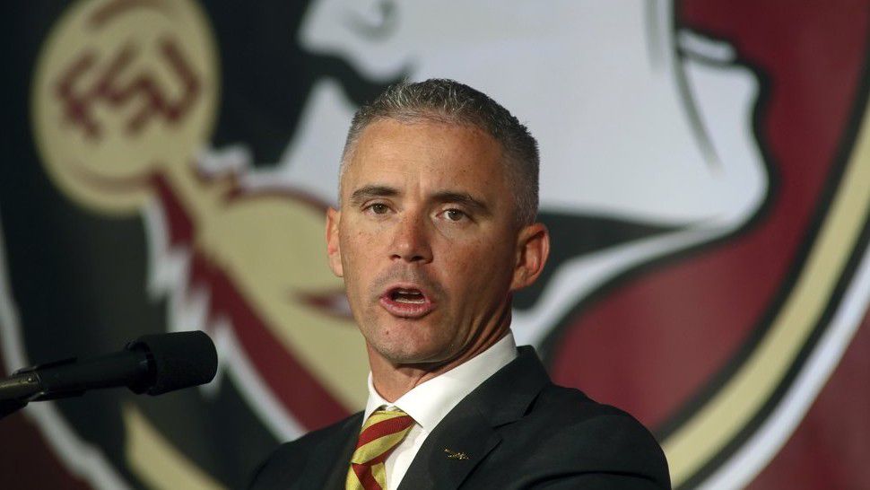 FILE - In this Dec. 8, 2019, file photo, Florida State head football coach Mike Norvell speaks at n during an NCAA college football press conference in Tallahassee, Fla. Norvell has tested positive for COVID-19 and will not coach the Seminoles in-person this week as they prepare for Miami. He released a statement Saturday, Sept. 19, 2020 saying he tested positive Friday. His wife and daughter tested negative Saturday morning, he said. (AP Photo/Phil Sears, File)