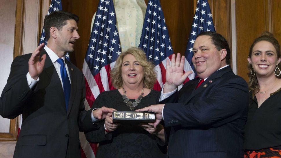 In this Jan. 3, 2017, file photo, House Speaker Paul Ryan of Wis. administers the House oath of office to Rep. Blake Farenthold, R-Texas, during a mock swearing in ceremony on Capitol Hill in Washington. The House Ethics Committee said Dec. 7 it is expanding its investigation into sexual harassment allegations against Farenthold. The committee said it will investigate whether Farenthold sexually harassed a former member of his staff and retaliated against her for complaining. The committee also said the panel would review allegations that Farenthold made inappropriate statements to other members of his official staff. ( AP Photo/Jose Luis Magana, File)