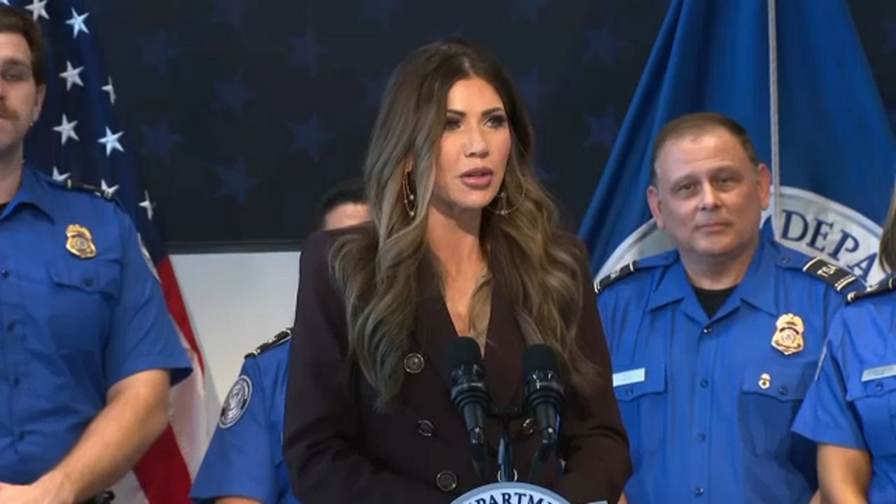 U.S. Secretary of Homeland Security presents bonuses to Tampa TSA workers