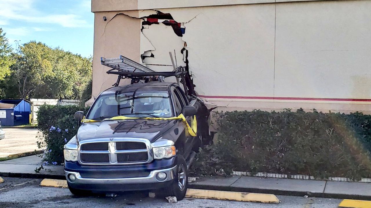 A pickup truck hit the side of a Chuck E. Cheese on International Drive on Monday. (Courtesy of @OCFireRescue/Twitter)