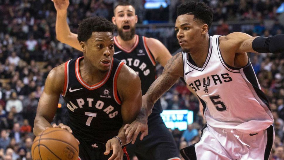 Toronto Raptors guard Kyle Lowry (7) drives on San Antonio Spurs guard Dejounte Murray (5) during the second half of an NBA basketball game Friday, Jan. 19, 2018, in Toronto. (Chris Young/The Canadian Press via AP)