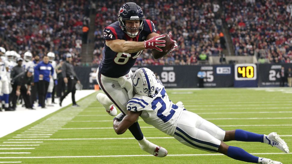 Houston Texans tight end Ryan Griffin (84) reaches for the goal line after catching a pass as Indianapolis Colts cornerback Kenny Moore (23) defends during the second half of an NFL football game Sunday, Dec. 9, 2018, in Houston. Griffin was ruled down just short of the end zone. (AP Photo/Michael Wyke)