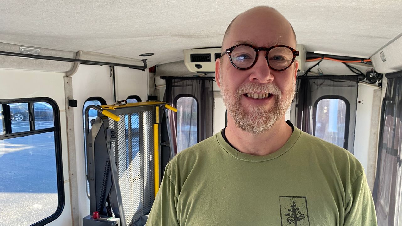 Massage therapist opening mobile therapy bus amid pandemic