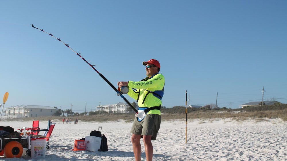 A shark fisherman fishes from shore. New rules drafted by FWC would create a permit and include other limits. (FWC)