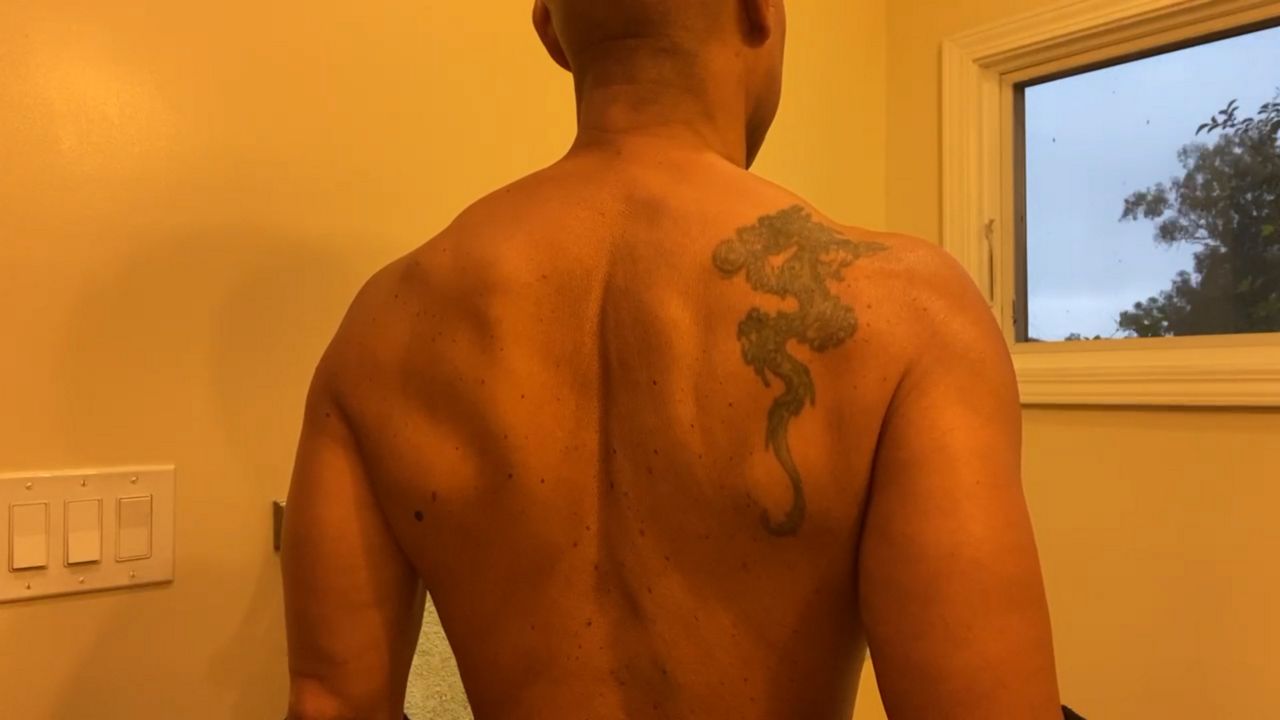 LAX Chief Cecil Rhambo bares tattoos to discredit deputy gang allegations