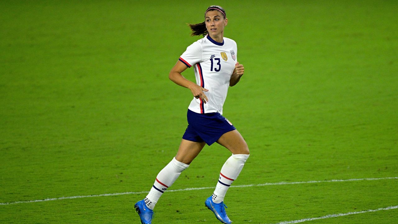 United States forward Alex Morgan (13) follows a play during the second half of a SheBelieves Cup women's soccer match against Canada, Thursday, Feb. 18, 2021, in Orlando, Fla. (AP Photo/Phelan M. Ebenhack)