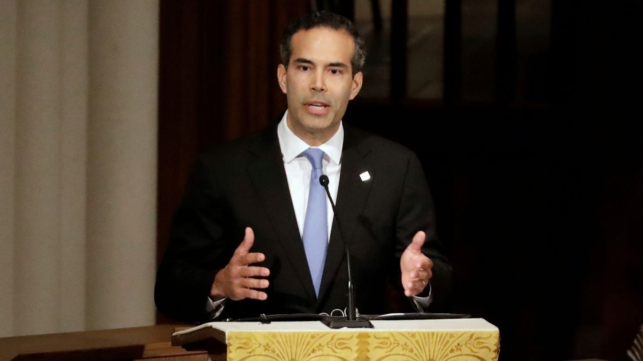In this Dec. 6, 2018 file photo, George P. Bush pauses as he gives a eulogy during a funeral for former President George H.W. Bush at St. Martin's Episcopal Church, in Houston. Bush condemned racism in his party Thursday, Dec. 12, 2019 over what he says is now a third instance in Texas this month of "racist or hateful rhetoric," the latest being a Facebook post that he suspects targets his own Hispanic family. (AP Photo/Mark Humphrey, File)