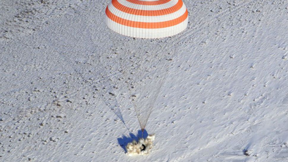 The Russian Soyuz MS-05 space capsule lands about 150 km (90 miles) south-east of the Kazakh town of Zhezkazgan, Kazakhstan, Thursday, Dec. 14, 2017. Three astronauts on Thursday landed back on Earth after nearly six months aboard the International Space Station. (AP Photo/Dmitri Lovetsky, Pool)