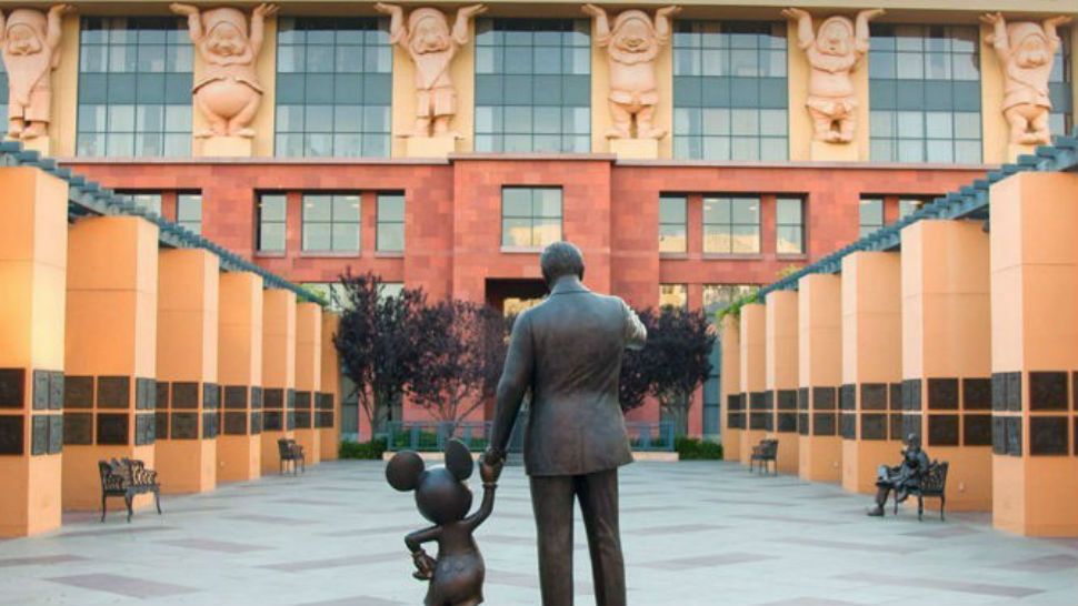 Walt Disney statue holds Mickey Mouse's hand. Courtesy/Disney
