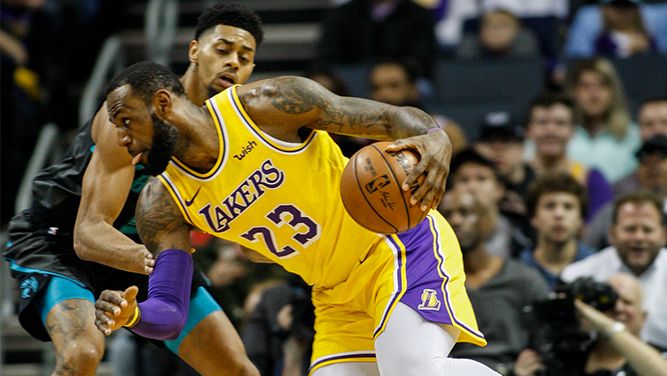 Lebron James dribbling to the hoop. 