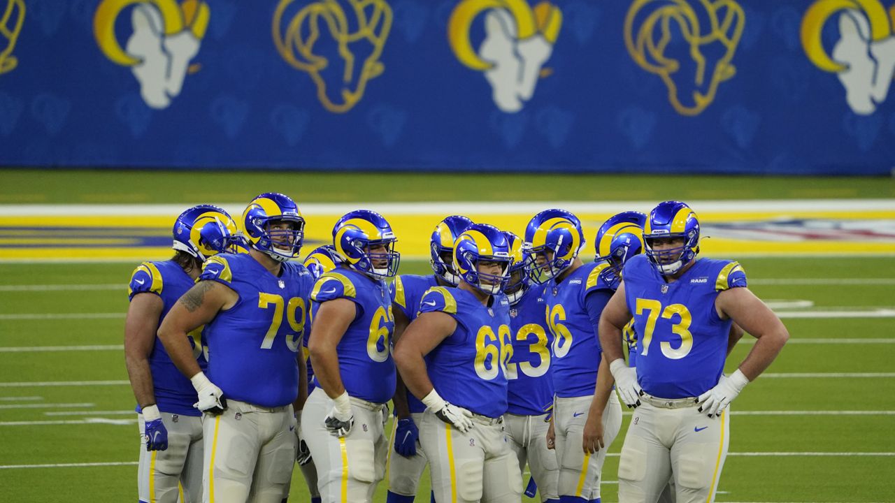 The Los Angeles Rams huddle during the first half of an NFL football game against the New England Patriots Thursday, Dec. 10, 2020, in Inglewood, Calif. (AP Photo/Jae C. Hong)