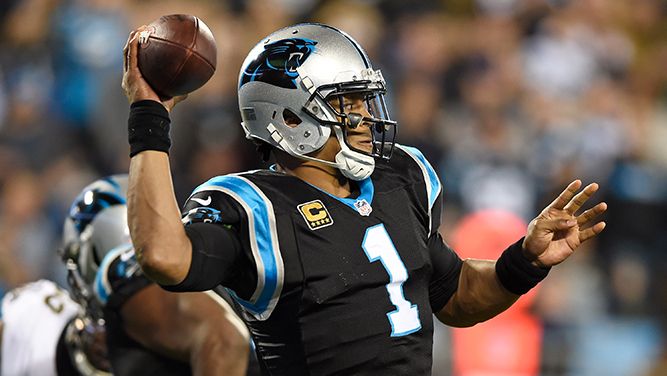 Cam Newton looks to make a pass.