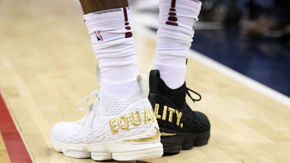 Cleveland Cavaliers forward LeBron James' shoes are emblazoned with "EQUALITY" on both heels during the first half of an NBA basketball game against the Washington Wizards, Sunday, Dec. 17, 2017, in Washington. (Nick Wass, AP)
