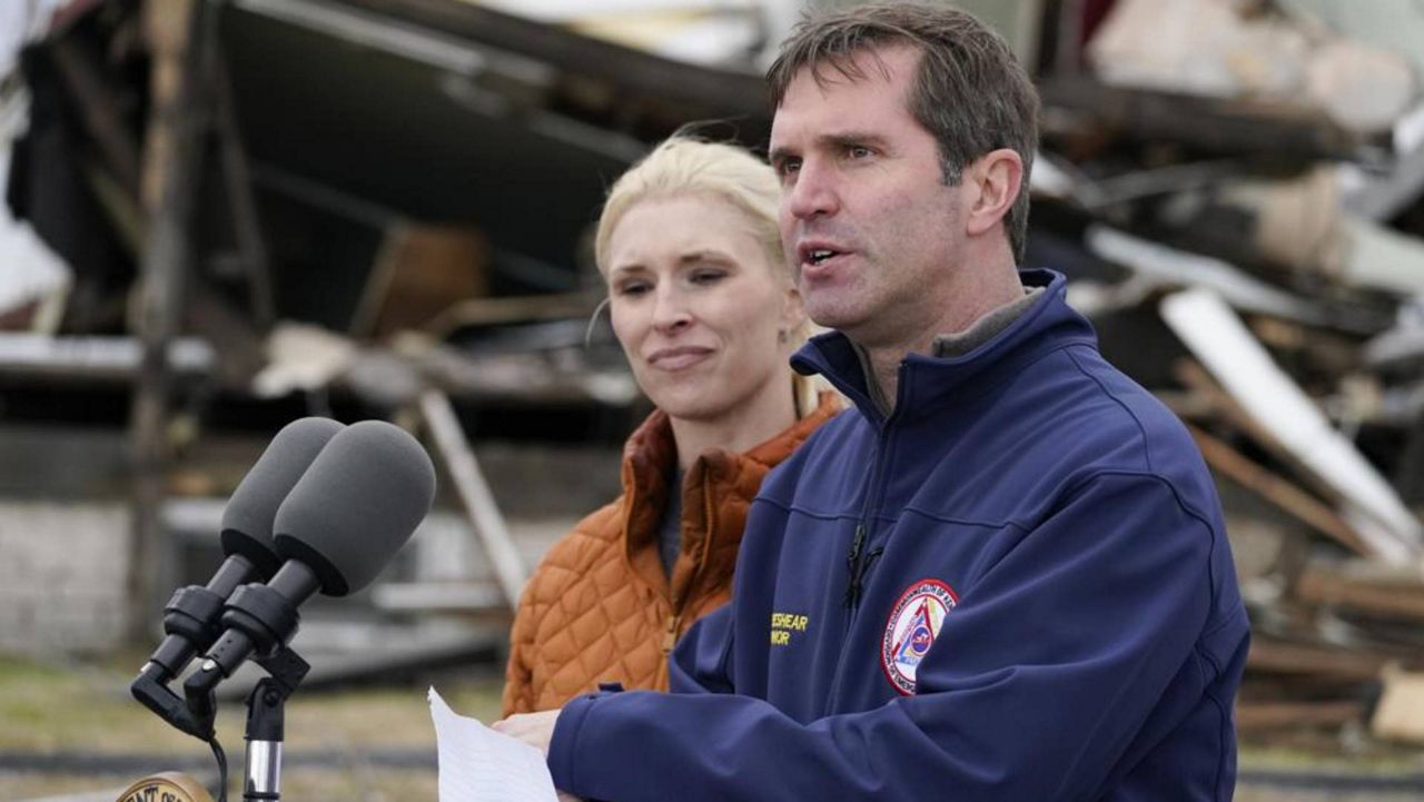 First lady Britainy Beshear and Gov. Andy Beshear speak at a press conference