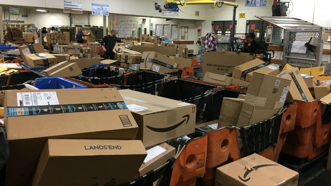 FILE- Packages being sorted at the post office. 