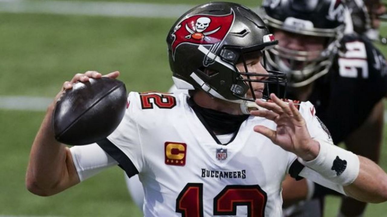 Atlanta Falcons defensive end Tyeler Davison applies pressure as Bucs quarterback Tom Brady works in the pocket. (John Bazemore/AP Photo)