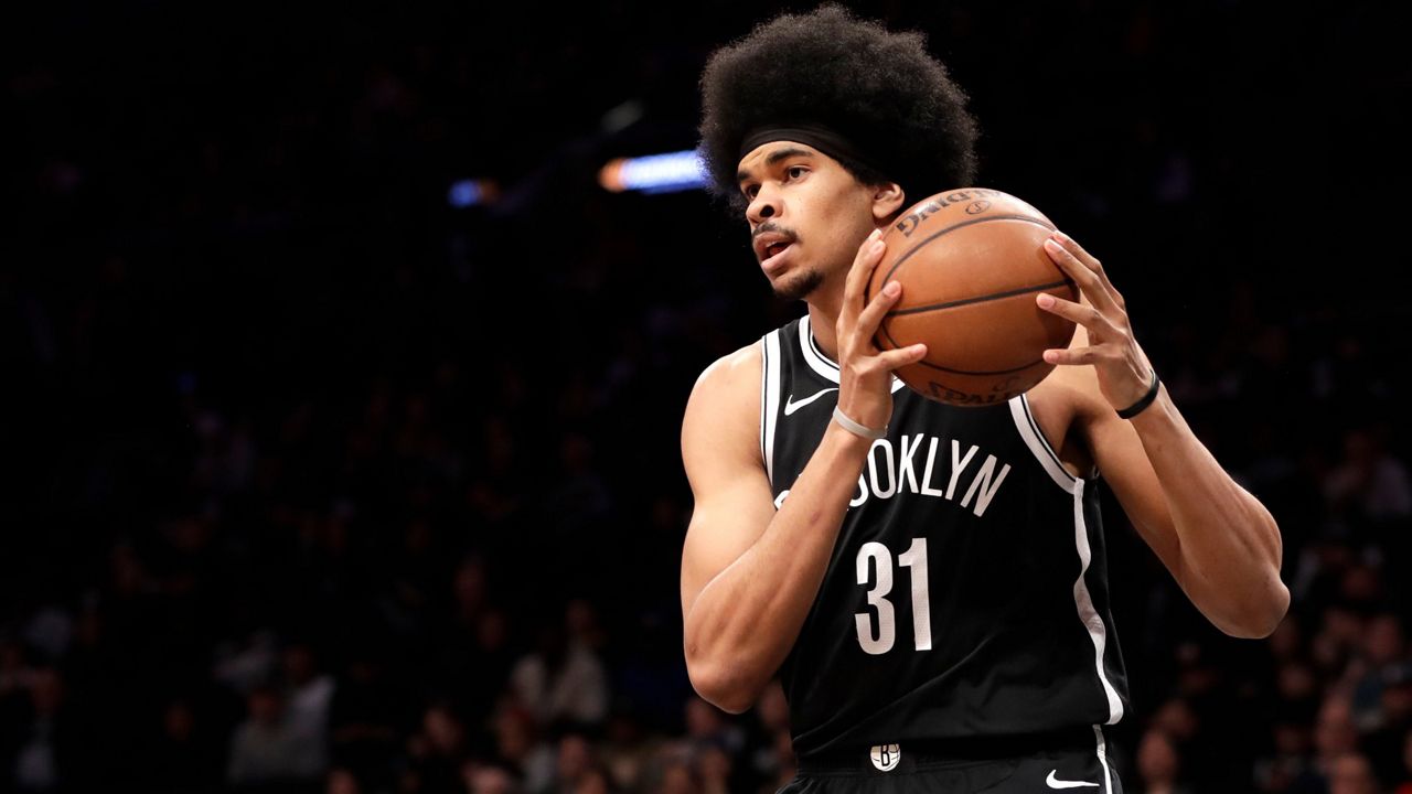 Brooklyn Nets Jarrett Allen looks to pass during the first half of an NBA basketball game against the San Antonio Spurs, Monday, Feb. 25, 2019, in New York. (AP Photo/Kathy Willens)