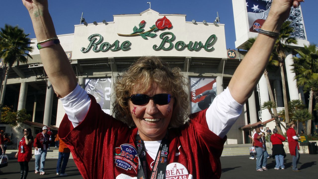 Angela Tompkins, from Mobile, Ala., poses in front of the Rose Bowl before the BCS Championship NCAA college football game in Pasadena, Calif., Jan. 7, 2010. (AP/Chris Carlson)