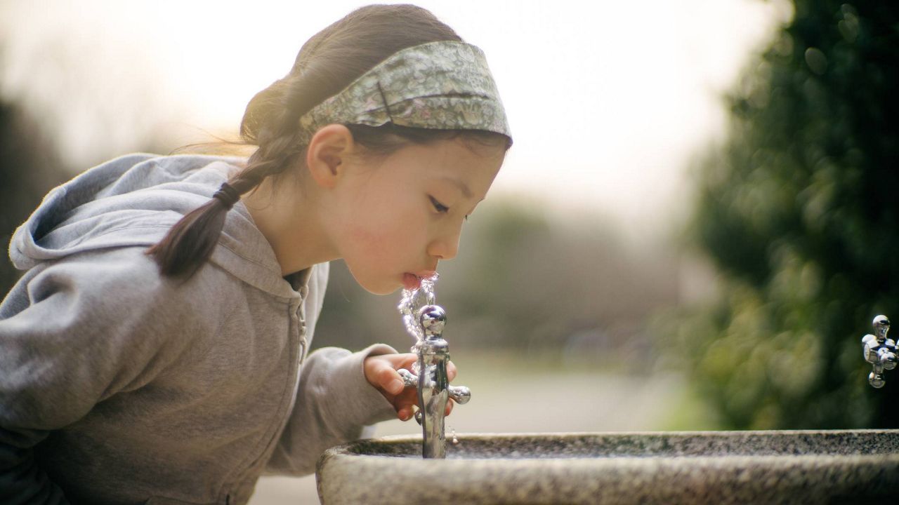 This child is drinking clean water. (Getty Images)