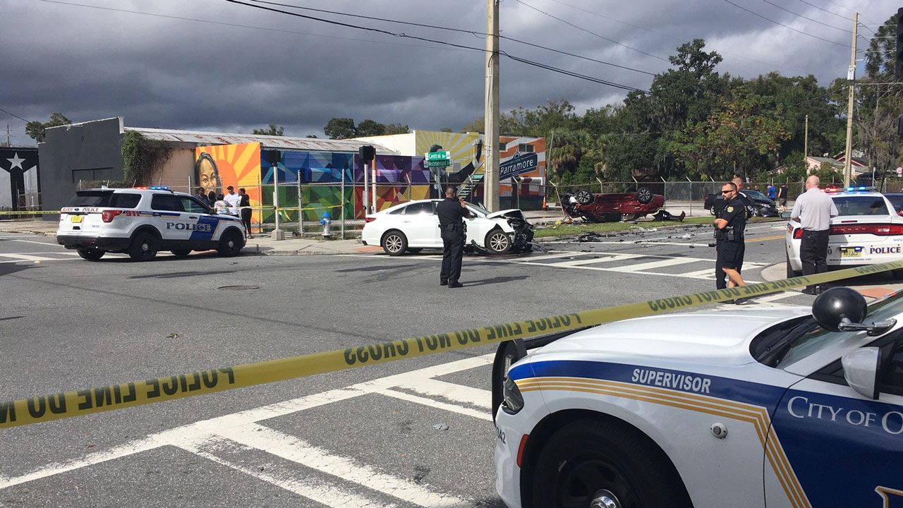A red car landed on its roof in a three-vehicle crash at Central Boulevard and Westmoreland Drive in Orlando. Police say the vehicle was stolen. (Arnie Girard, Spectrum News)