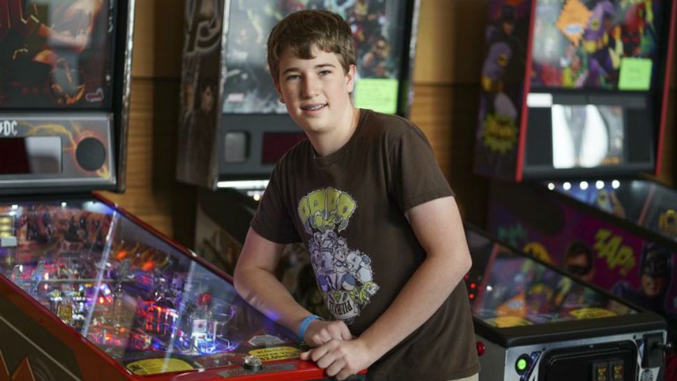 In this Oct. 13, 2017 photo, Escher Lefkoff poses for a photo at the Pinball Expo 2017 in Chicago. Lefkoff won the Professional and Amateur Pinball Association’s World Championships last spring. Interest in pinball has skyrocketed over the last decade or so, with the number of players and competitions growing worldwide, according to the International Flipper Pinball Association, or IFPA. (AP Photo/Teresa Crawford)