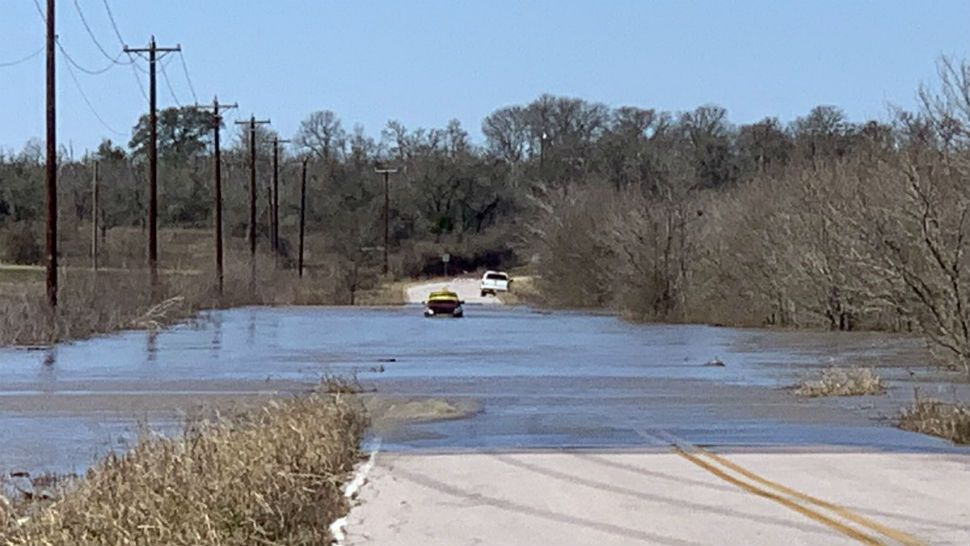 Abandoned car found stuck in high waters at Taylor Lane and Decker Lake Road after severe weather overnight on Thursday, December 27.