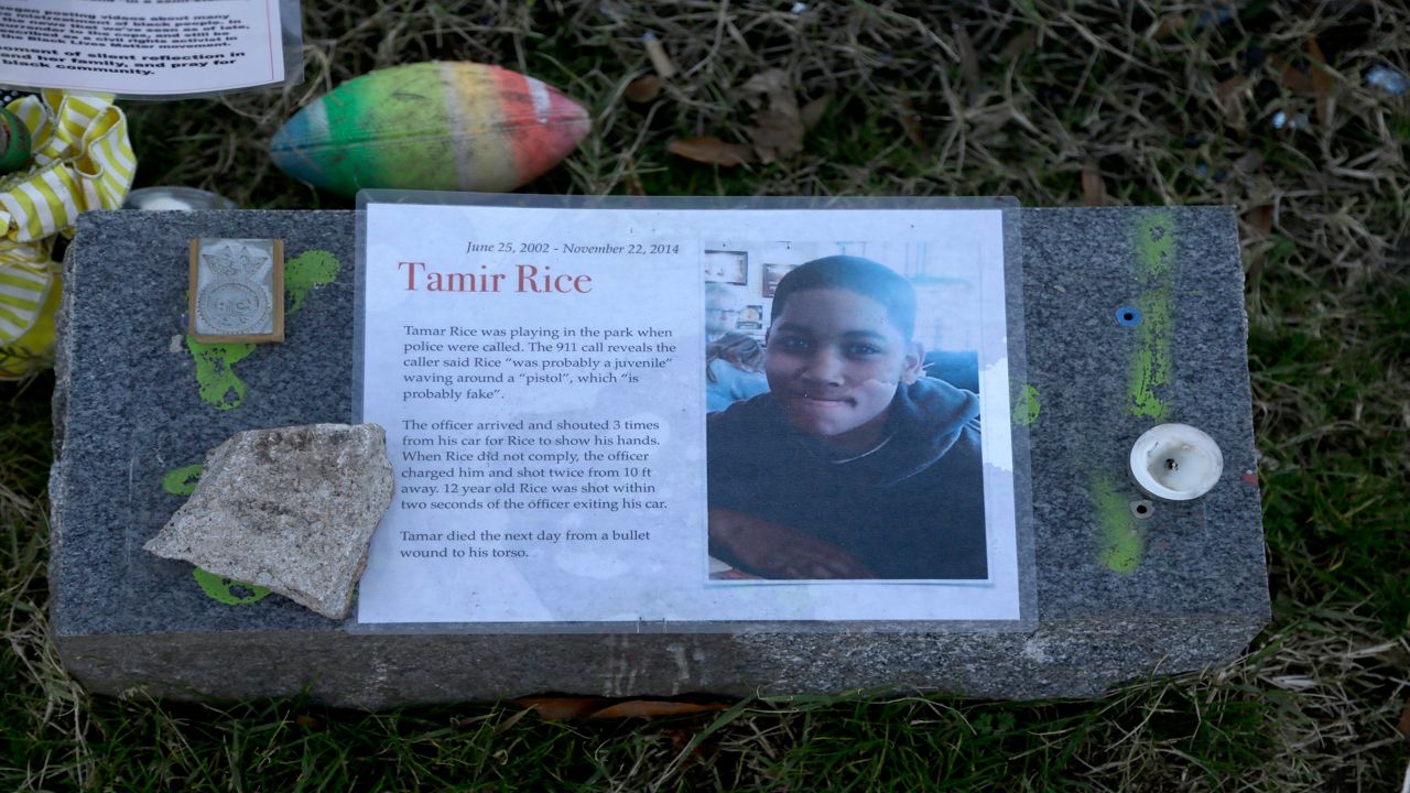 A stone with a boy's picture on it
