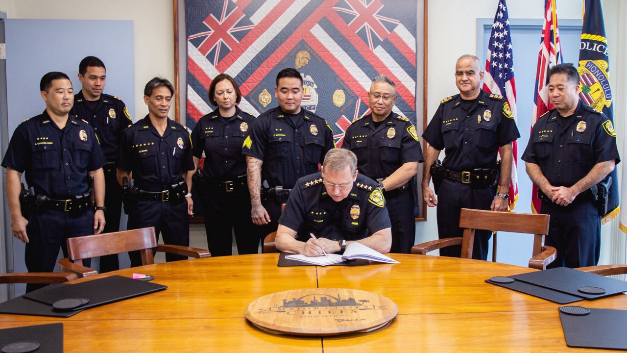 Honolulu Police Department Chief Joe Logan signed the first concealed carry permit issued since the Supreme Court's June ruling in the Bruen case. (Courtesy of Honolulu Police Department)