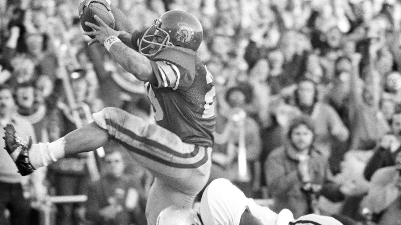 Running back Anthony Davis of the USC Trojans gives a big kick as he crosses the goal line to score in the third quarter against the Ohio State Buckeyes during the the Rose Bowl in Pasadena, Calif., Jan. 1, 1973. (AP Photo)