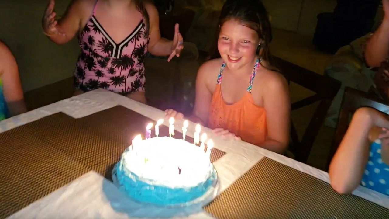 In this undated photo from video provided by the family, Sophia Nelson smiles as she's surrounded by friends and family during a birthday party. Sophia's death in a crash on State Road A1A earlier this month is raising concerns about crosswalks in the area. (Screen capture from video courtesy of Nelson family)