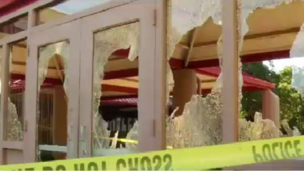 Broken windows at Bowie High School following vandalism incident. (Spectrum News footage)