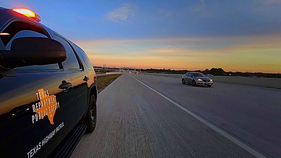 Texas DPS car sits on the side of a road as a car approaches. (Picture courtesy Texas DPS Facebook page)