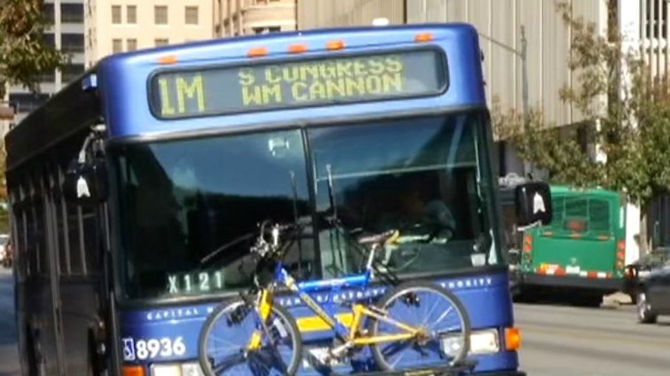 A blue Capital metro bus. 