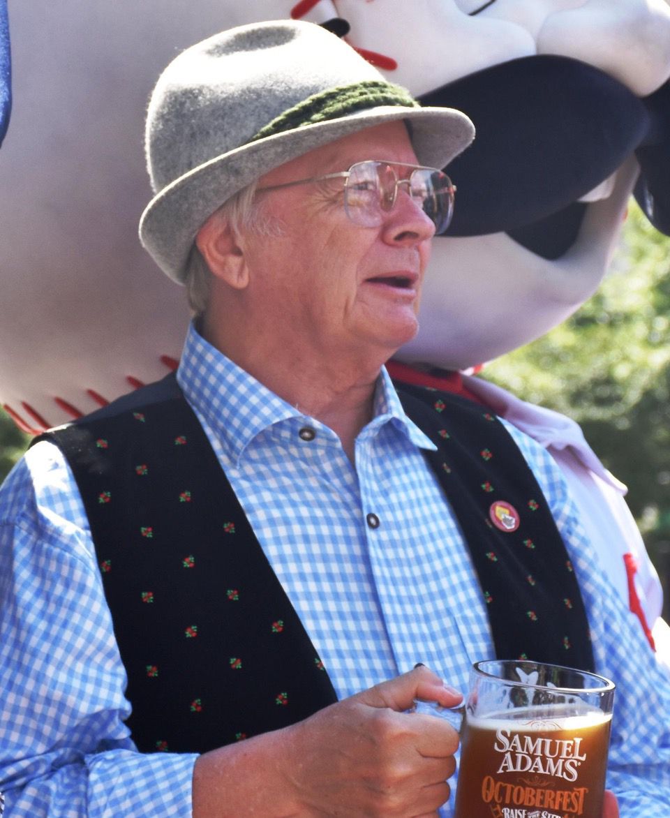 A man in Oktoberfest attire holds a beer glass during Oktoberfest Zinzinnati (Casey Weldon | Spectrum News 1)