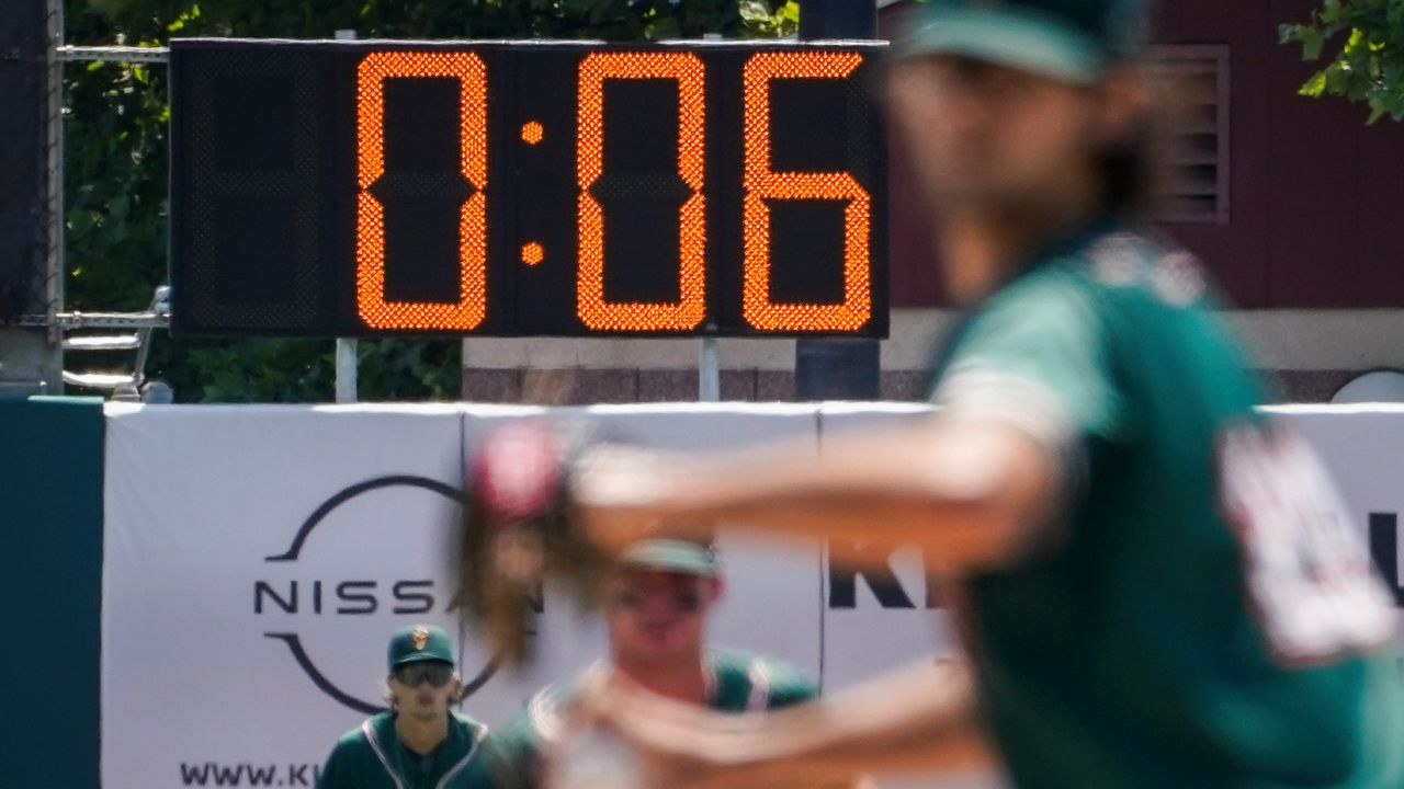 A pitch clock is deployed to restrict pitcher preparation times during a minor league baseball game between the Brooklyn Cyclones and Greensboro Grasshoppers, Wednesday, July 13, 2022, in the Coney Island neighborhood of the Brooklyn borough of New York. (AP Photo/John Minchillo)