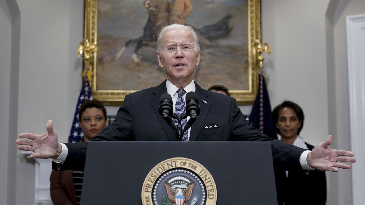 President Joe Biden speaks about deficit reduction, in the Roosevelt Room at the White House in Washington, Friday, Oct. 21, 2022. Biden is flanked by, Office of Management and Budget Director Shalanda Young, left, and Council of Economic Advisers Chairwoman Cecilia Rouse. (AP Photo/J. Scott Applewhite)