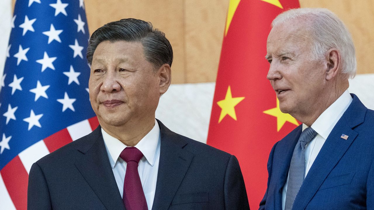President Joe Biden, right, stands with Chinese President Xi Jinping before a meeting on the sidelines of the G20 summit meeting on Nov. 14, 2022, in Bali, Indonesia. (AP Photo/Alex Brandon)
