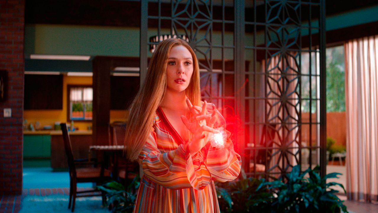 This image released by Disney+ shows Elizabeth Olsen in "WandaVision." (Disney+ via AP)