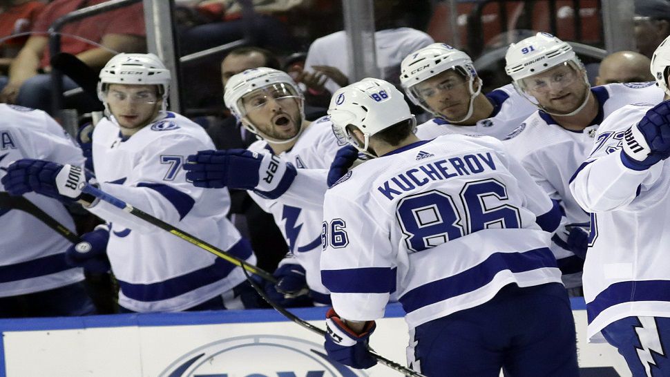 Tampa Bay Lightning winger Nikita Kucherov (86) is congratulated by his teammates after scoring his 23rd goal of the season in the first period.  Kucherov added another goal in the third period as the Lightning powered past the Panthers 5-2 in Sunrise.  (AP Photo/Lynne Sladky)