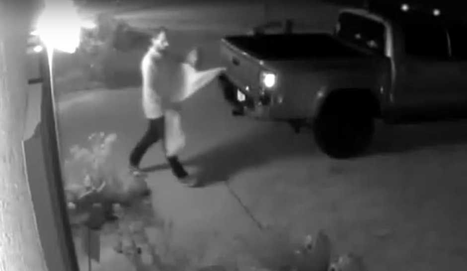 Surveillance footage from a home in the Willow Walk subdivision shows a man walking a way with one of the Halloween decorations hanging in the front yard.