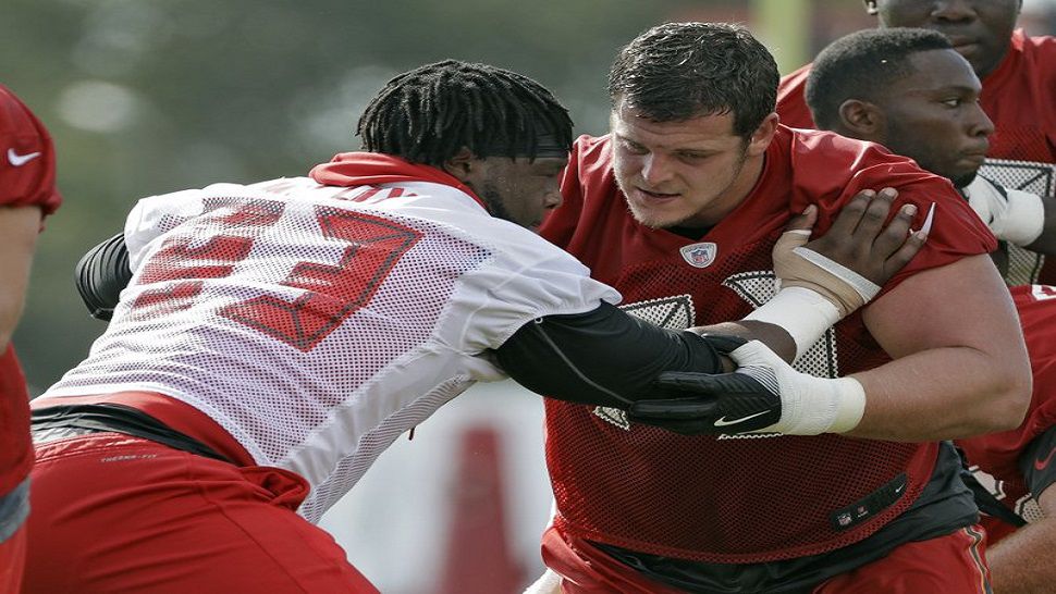 Buccaneers DT Gerald McCoy working in 2017 training camp against former Bucs guard J.R. Sweezy.  (AP File Photo)