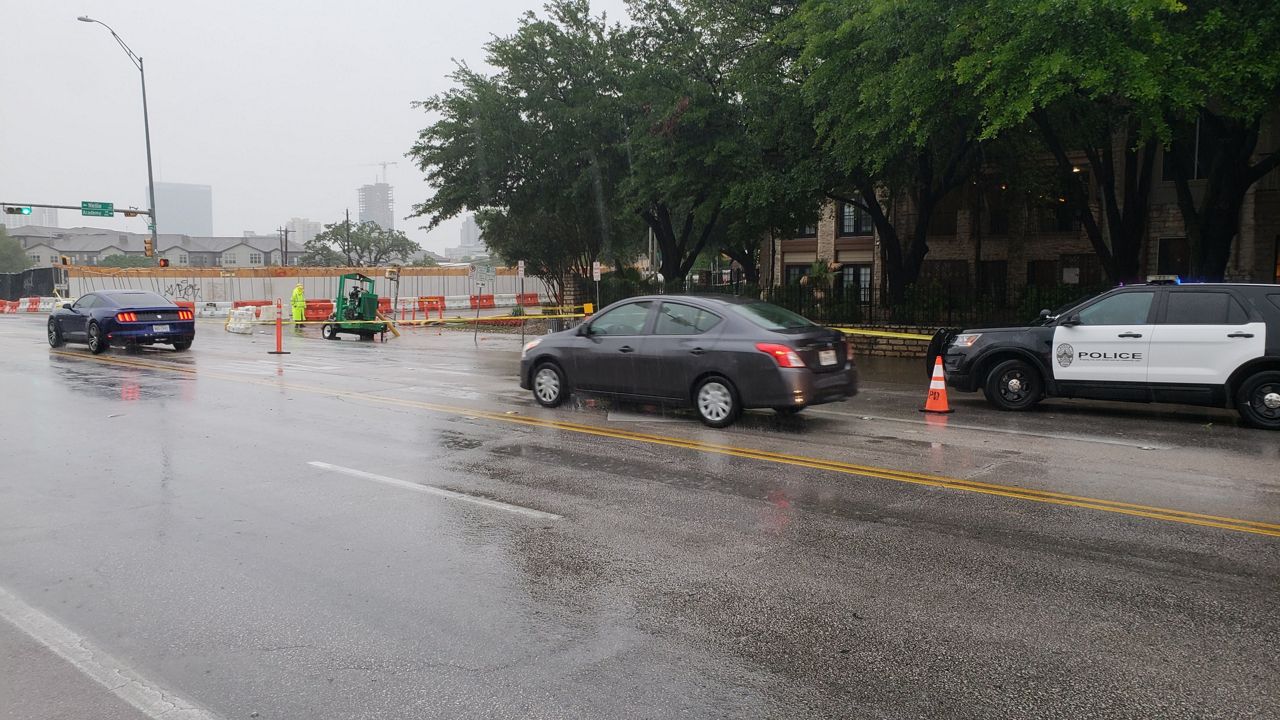 Water on the road has this section of South Congress Avenue blocked off by police. 